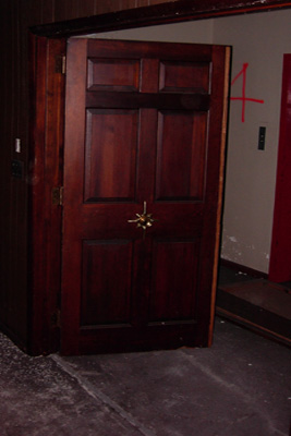 An ofice door on the fourth floor. The center set starburst handle in the door adds a touch of, ahh, well, something.