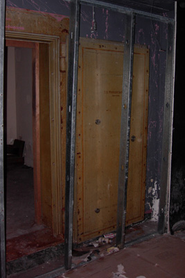 There are two open vaults in the basement. Both were covered over with drywall and left.